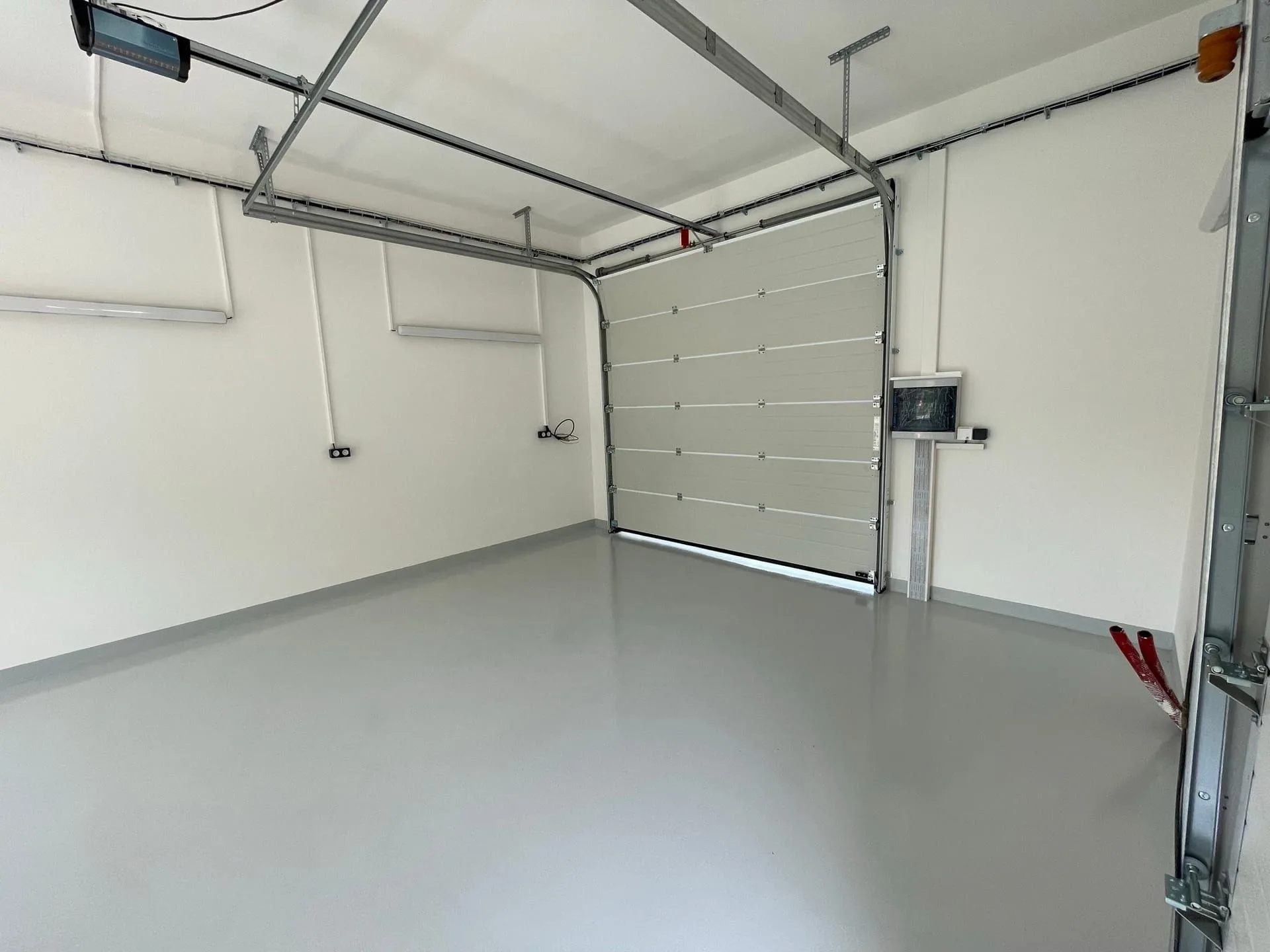 Completed garage interior with a poured floor